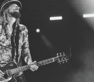 A black and white image showing guitar virtuoso Wayne Camilleri