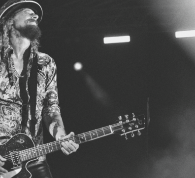 A black and white image showing guitar virtuoso Wayne Camilleri