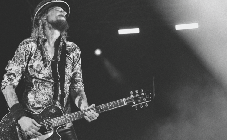 A black and white image showing guitar virtuoso Wayne Camilleri