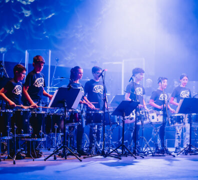 A scene from TISBIT, a dynamic percussion concert by The Clef House students, featuring a mix of percussionists, a rhythm section, and guest singers, under the direction of Michael Camilleri at Teatru Manoel.