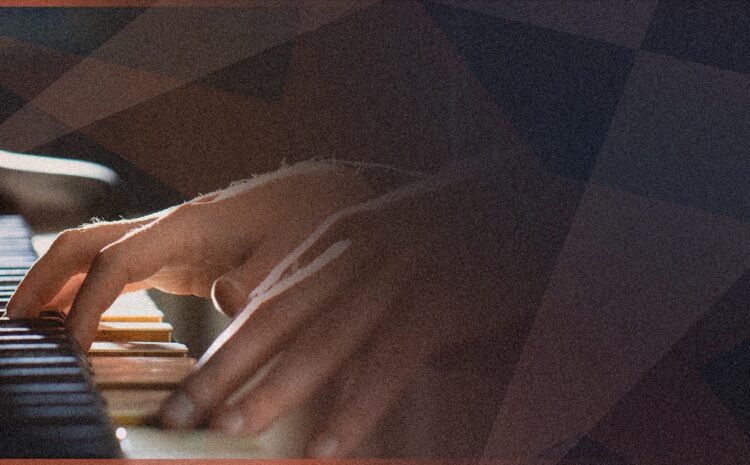 A photo showing a close-up of a pianist's hands