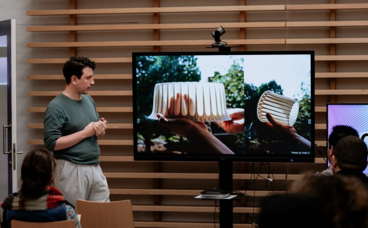 A photo showing a speaker and the audience at one opf the past FiftSix Design Talks