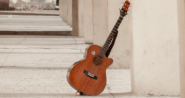 An image showing a guitar among architecture