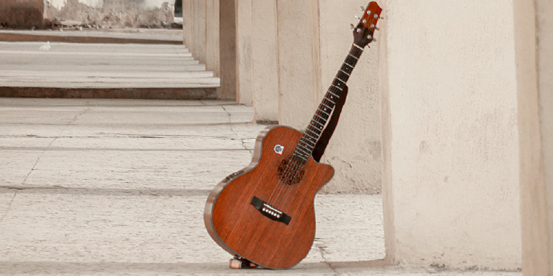 An image showing a guitar among architecture